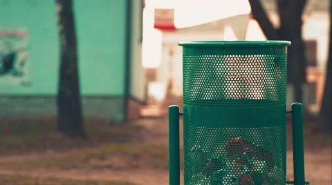 Woman Throws Trash in Dustbin Stock Footage 48401633