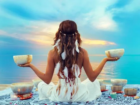 Woman with Tibetan Singing Bowls. Relaxation and Meditation at Sunset Beach. Stock Photos