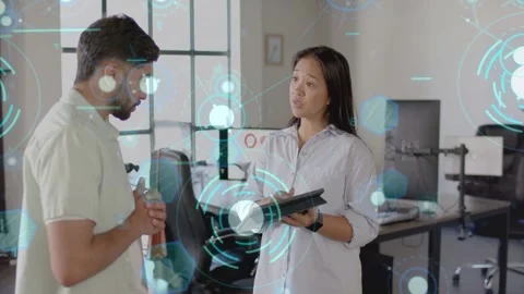 Woman tilting tablet explaining office data causing blue HUD rings marking chart Stockbeeldmateriaal 333233383