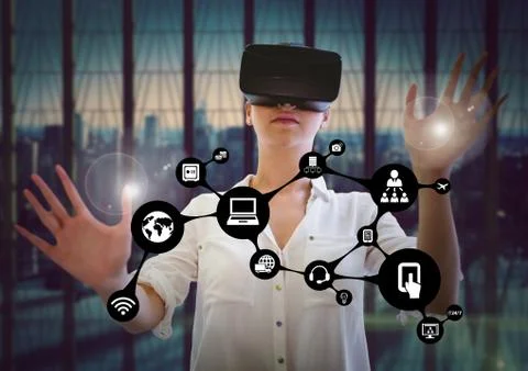 Woman touching interface flare while using virtual reality headset Stock Photos