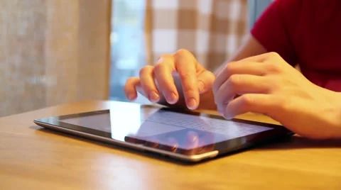 Woman touching screen and browsing on tablet Stock Footage 53229607