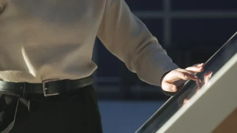Woman is touching a screen with her hand Stock Footage 303053009