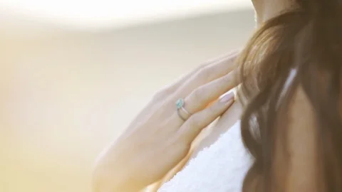 Woman touching skin in back light Stock Footage 97891553