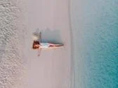 Woman Tourist On The Beach, Top View. Stock Photos