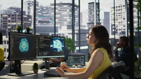 Woman training AI predictive models capable of handling resource intensive tasks Stock Footage 318235074
