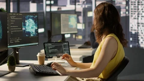 Woman training AI predictive models capable of handling resource intensive tasks Stock Footage 318235953