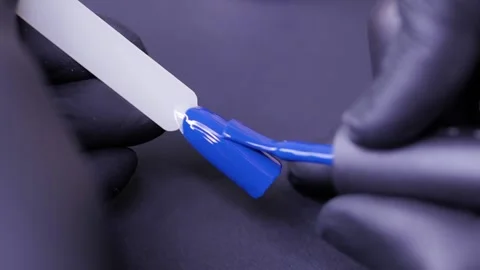 Woman training to do manicure using false nails. Video stock 119636644