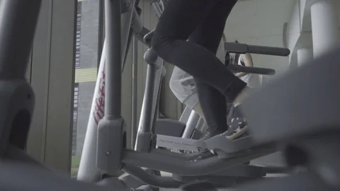 Woman Training On Ellipse Exercise Machine Stock-Footage 83522778