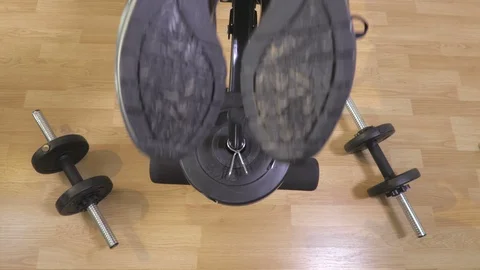 Woman training hamstrings on gym machine Stock Footage 118516031
