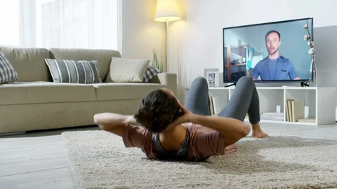 Woman Training at Home with Video Tutorial Stock Footage 90688027