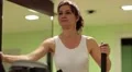 Woman trains in gym. Woman on a orbitrek exercise equipment HD Footage