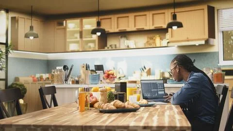 Woman transcribing data for research using laptop and digital tools Stock Photos