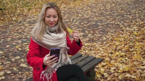 A woman tries to take a selfie, but almost misses her phone Stock Footage 255072553