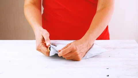 Woman trying to break poly envelope, package, Stock Footage 112282167