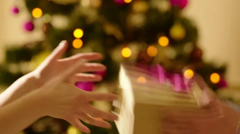 Woman Trying to Catch a Present Box Stock Footage 57748880
