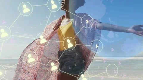 Woman turning at beach, causing network nodes and globe to expand, showing Stock Footage 332772281