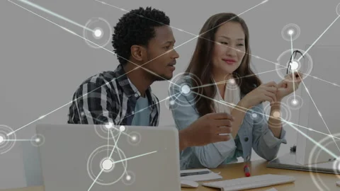 Woman turning glasses starting node map overlay, colleagues leaning and Stock Footage 331046080
