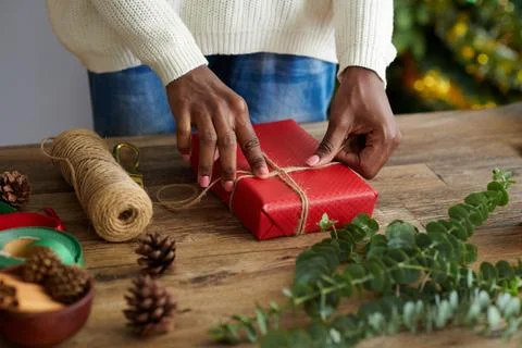 Woman Tying Present with Twine Stock Photos