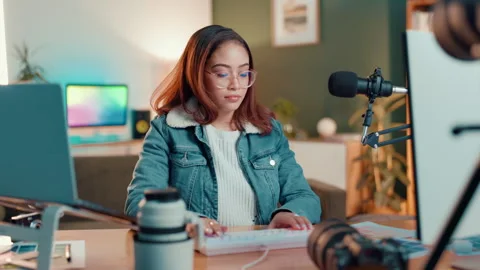 Woman, typing and computer for content creation by mic, review and script Stock Footage 310612620
