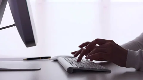 Woman typing on a computer. Dolly. Stock Footage 33909224