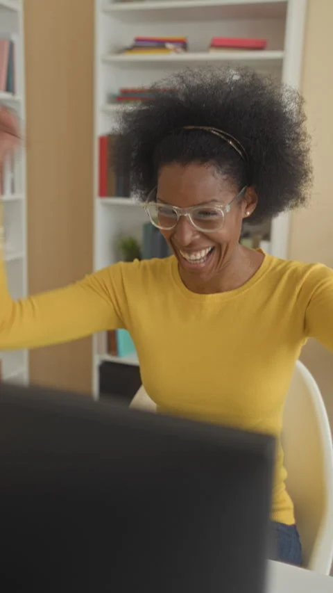 Woman typing on computer with hands on keyboard then cheering with raised f.. Stock Footage 337377439