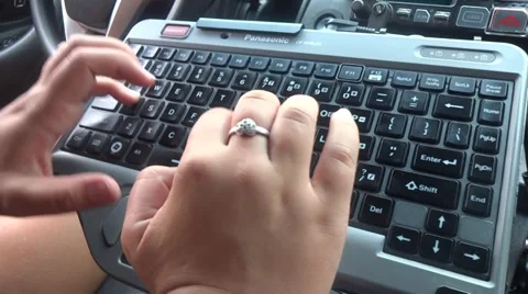 Woman typing computer inside  car 스톡 동영상 27823020