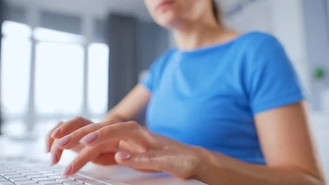 Woman typing on a computer keyboard. Concept of remote work. Stock Footage 128798207