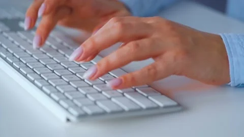 Woman typing on a computer keyboard. Concept of remote work. Stock Footage 133718476