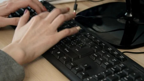 Woman typing on computer keyboard Stock Footage 125454657