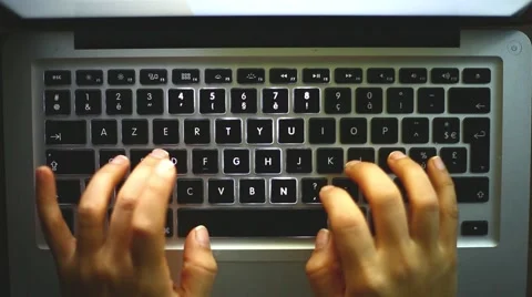 Woman typing on a computer at night Stock Footage 46264825
