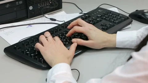 Woman typing on the computer in the office Stock Footage 45913260