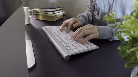 Woman typing on computer in office Stock Footage 95076119