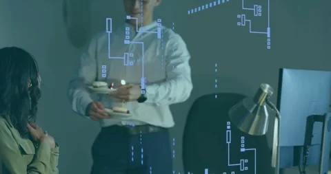 Woman typing on computer at office looking up at man entering holding lit Stock-Footage 318140405