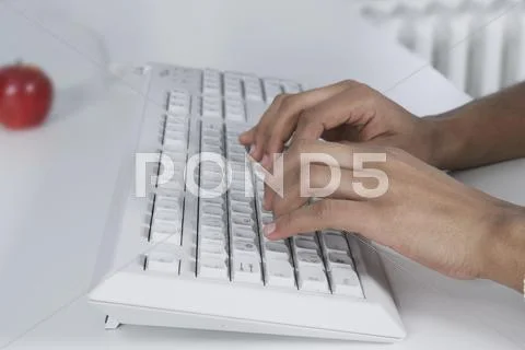 Woman typing on keyboard Stock Photos