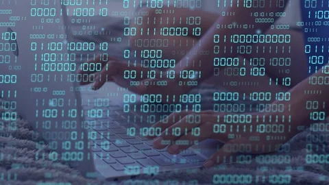 Woman typing on keyboard, starting coding; cyan binary code drifting over hands, Stock Footage 335731950