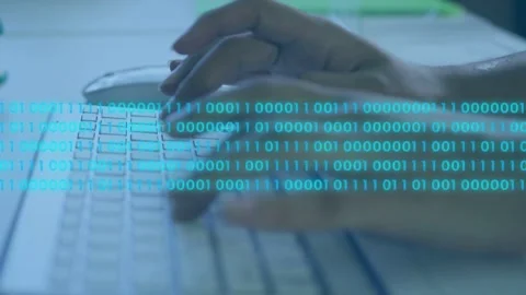 Woman typing at keyboard, using mouse, activating binary overlay visualizing Stock Footage 335283103