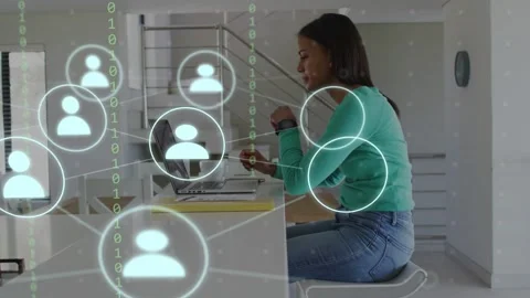 Woman typing at kitchen counter, causing circle, forming user icons, binary Stock Footage 333873671