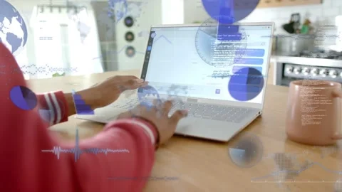 Woman typing at kitchen table, causing blue data overlays to grow, engaging with Stock Footage 332981480
