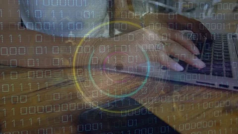 Woman typing laptop activating binary grid and pulsing HUD, entering data for Stock Footage 326993872