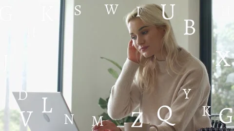 Woman typing on laptop, causing floating letters across screen, pausing, gazing Stock Footage 333145596