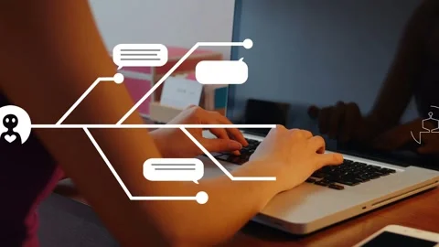 Woman typing on laptop causing user node branching into chat bubbles and AI icon Stock Footage 334703708