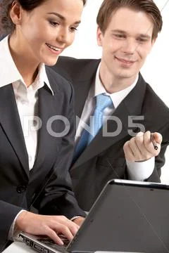 A woman typing on laptop by her chief Stock Photos