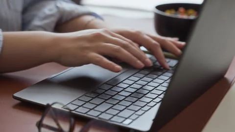 Woman Typing on Laptop Keyboard While Working at Office Desk Stock Footage 341565113