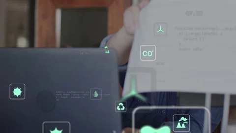 Woman typing laptop, pulling eco print, inspecting pages as AR charts overlaying Stock Footage 335762121