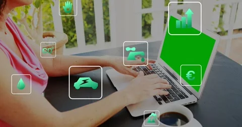 Woman typing on laptop for remote work, causing finance icons drifting across Stock Footage 329122121