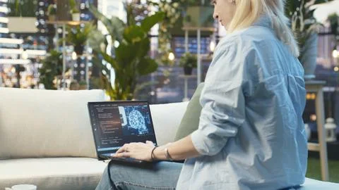 Woman typing on laptop with source code and AI cloud computing Stock Photos