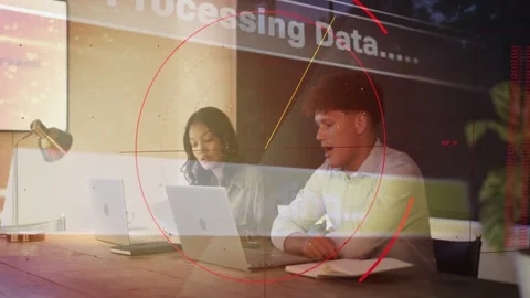 Woman typing, man checking notes at table, opening laptops activating data HUD Stock Footage 333609628