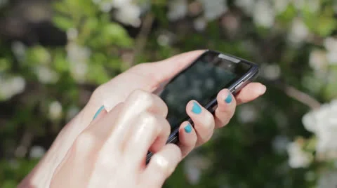 Woman typing a message using smartphone Stock Footage 26379083