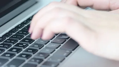Woman typing on notebook, close up Video stock 69854310