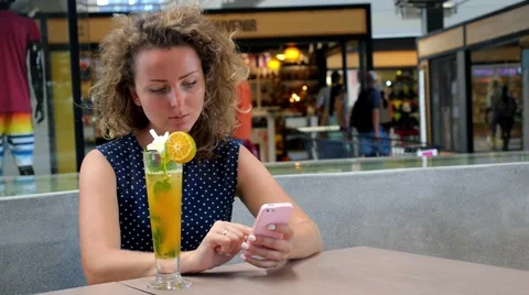 Woman Typing Text Message on Smart Phone in a Cafe 스톡 동영상 54624348